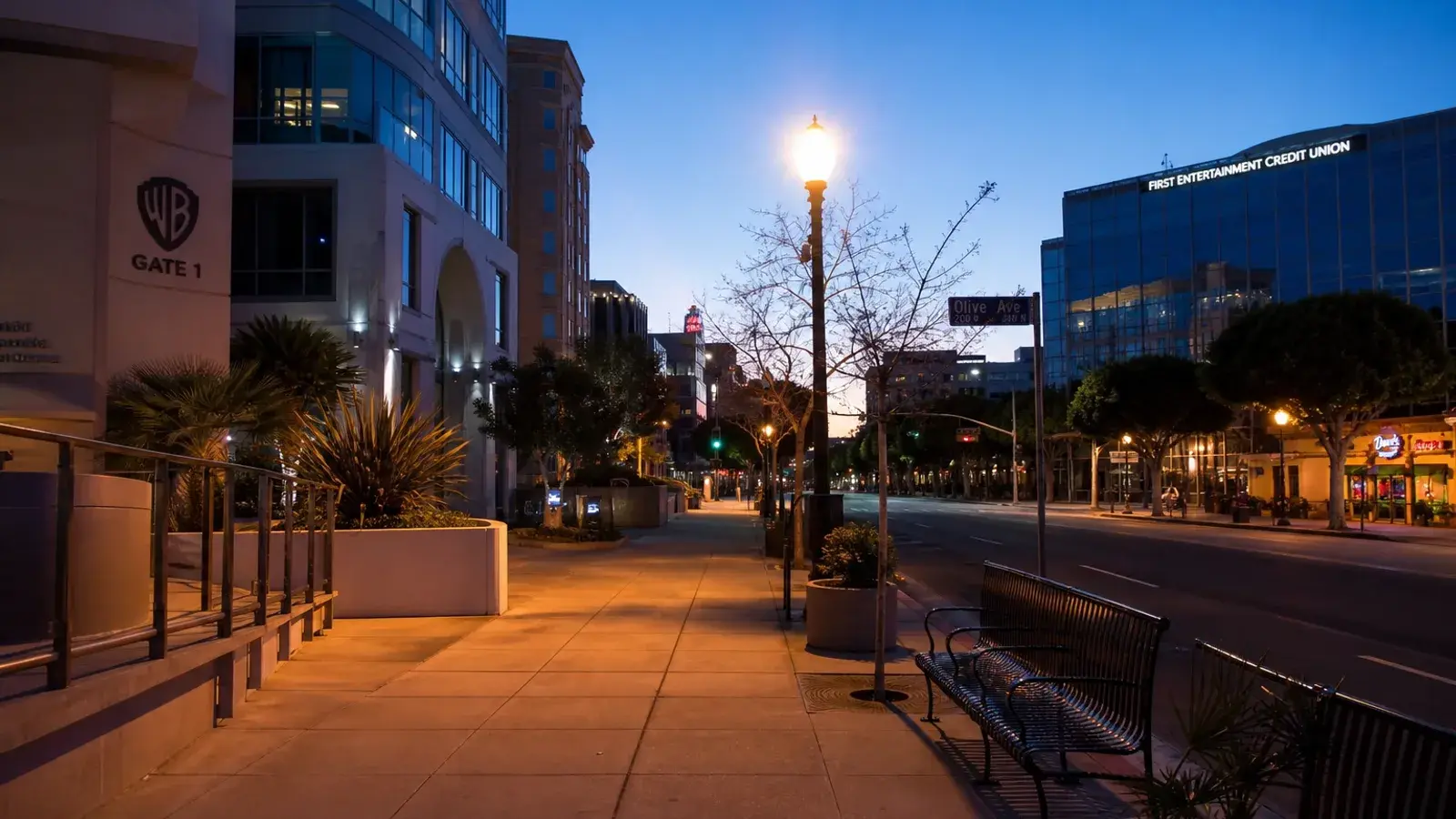 Quiet downtown Burbank street at blue hour — discreet gynecomastia logistics mood | SurgiSculpt®