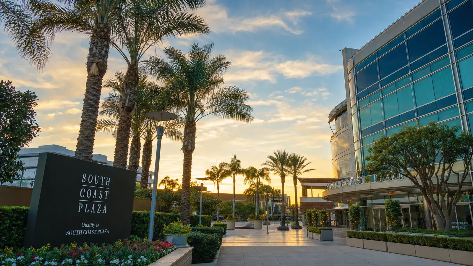 South Coast Plaza area outdoor palm plaza at golden hour — HD Liposuction Costa Mesa lifestyle | SurgiSculpt®