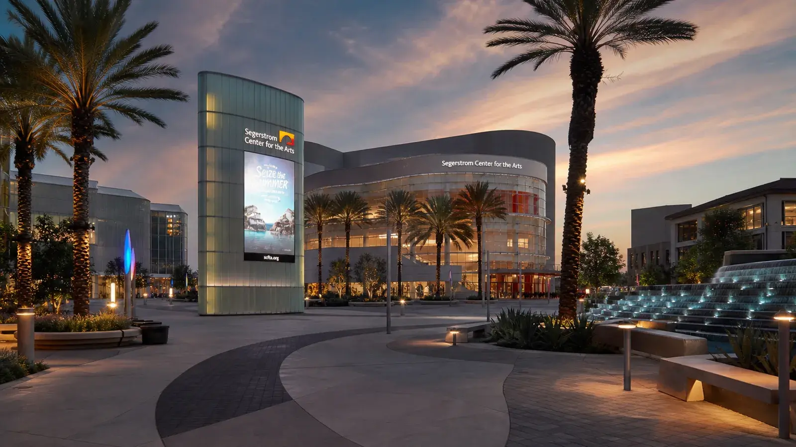 Costa Mesa arts and theater district outdoor plaza at dusk — HD Liposuction context | SurgiSculpt®