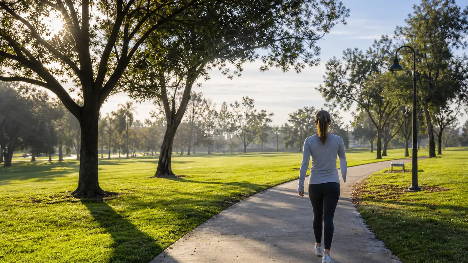 Costa Mesa community park green lawns and shade trees — tummy tuck recovery mood | SurgiSculpt®