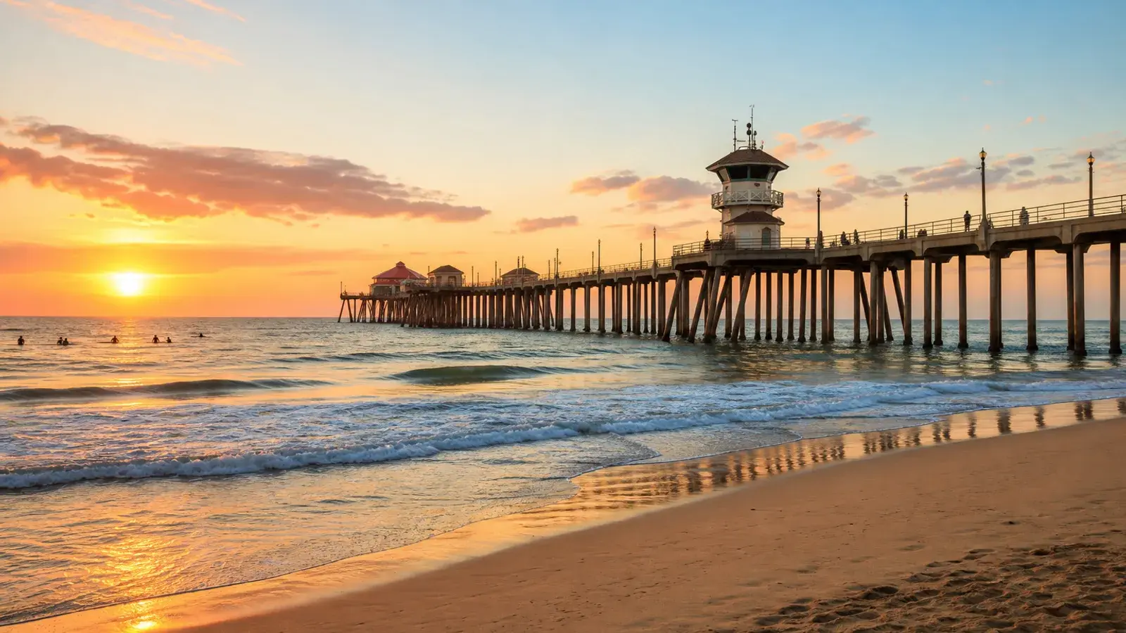 Huntington Beach pier and wide shoreline at golden hour — HD Liposuction lifestyle | SurgiSculpt®