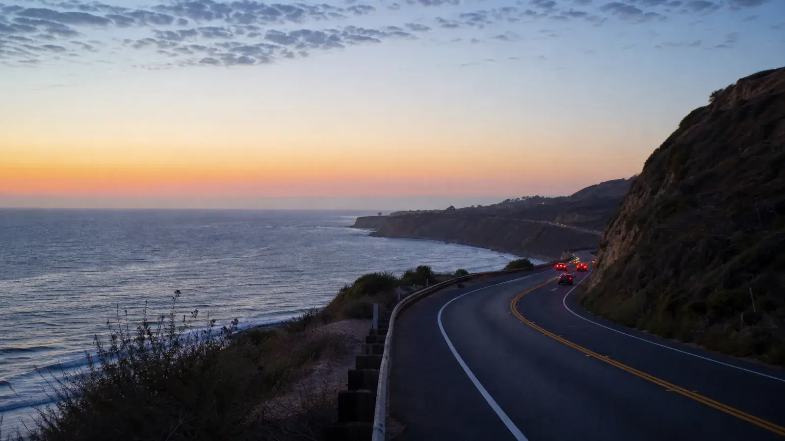 Pacific Coast Highway coastal stretch near Huntington Beach at dusk — HD Liposuction context | SurgiSculpt®