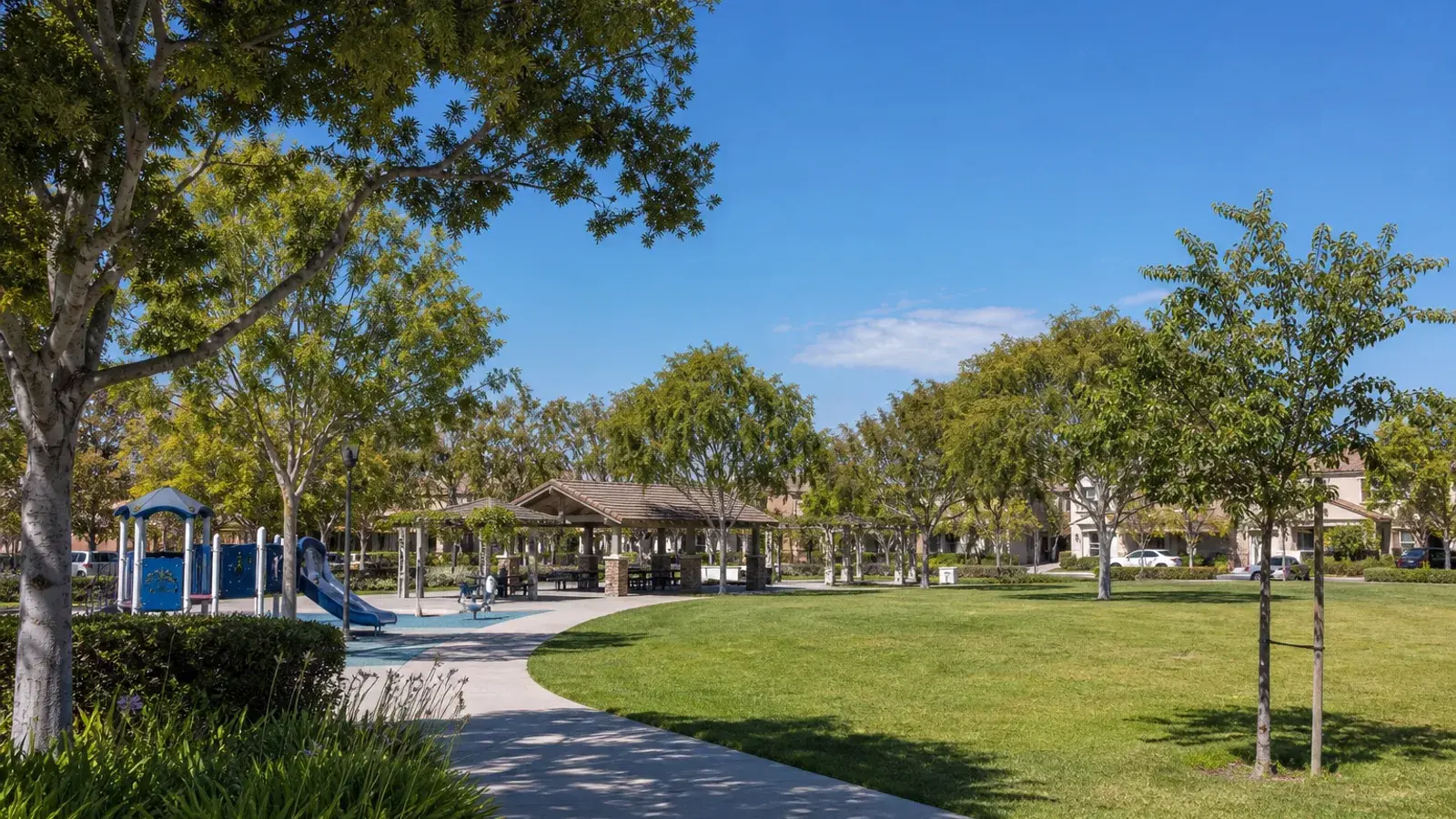 Sunny Irvine neighborhood park playground greens outdoors — mommy makeover context | SurgiSculpt®