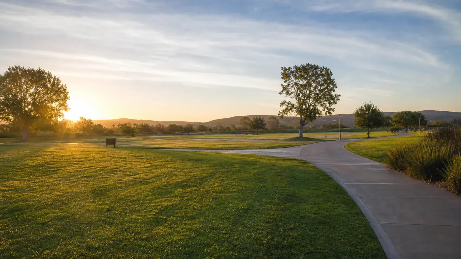 Irvine Great Park open lawns and paths at sunrise — tummy tuck lifestyle | SurgiSculpt®