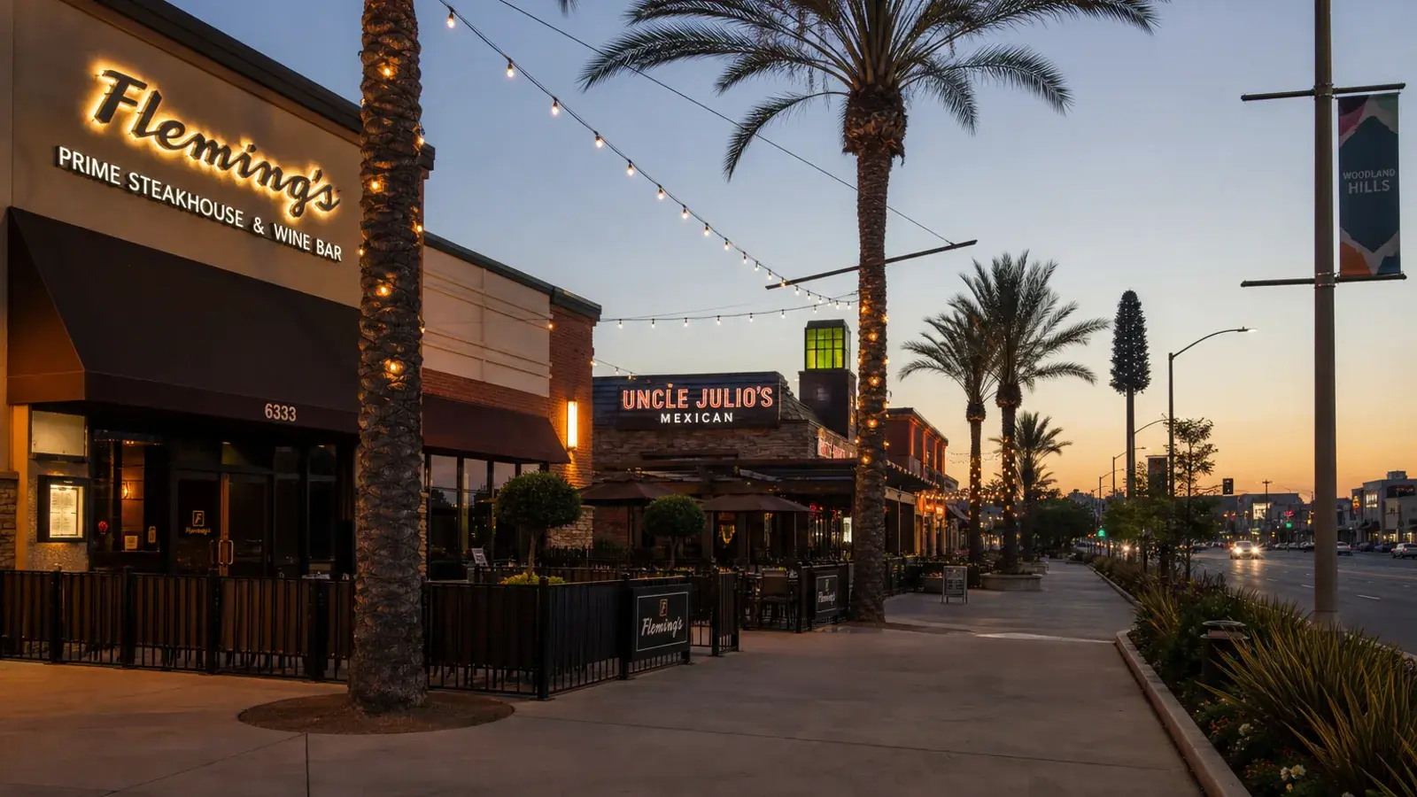 Woodland Hills shopping plaza exteriors at dusk — Brazilian Butt Lift lifestyle | SurgiSculpt®