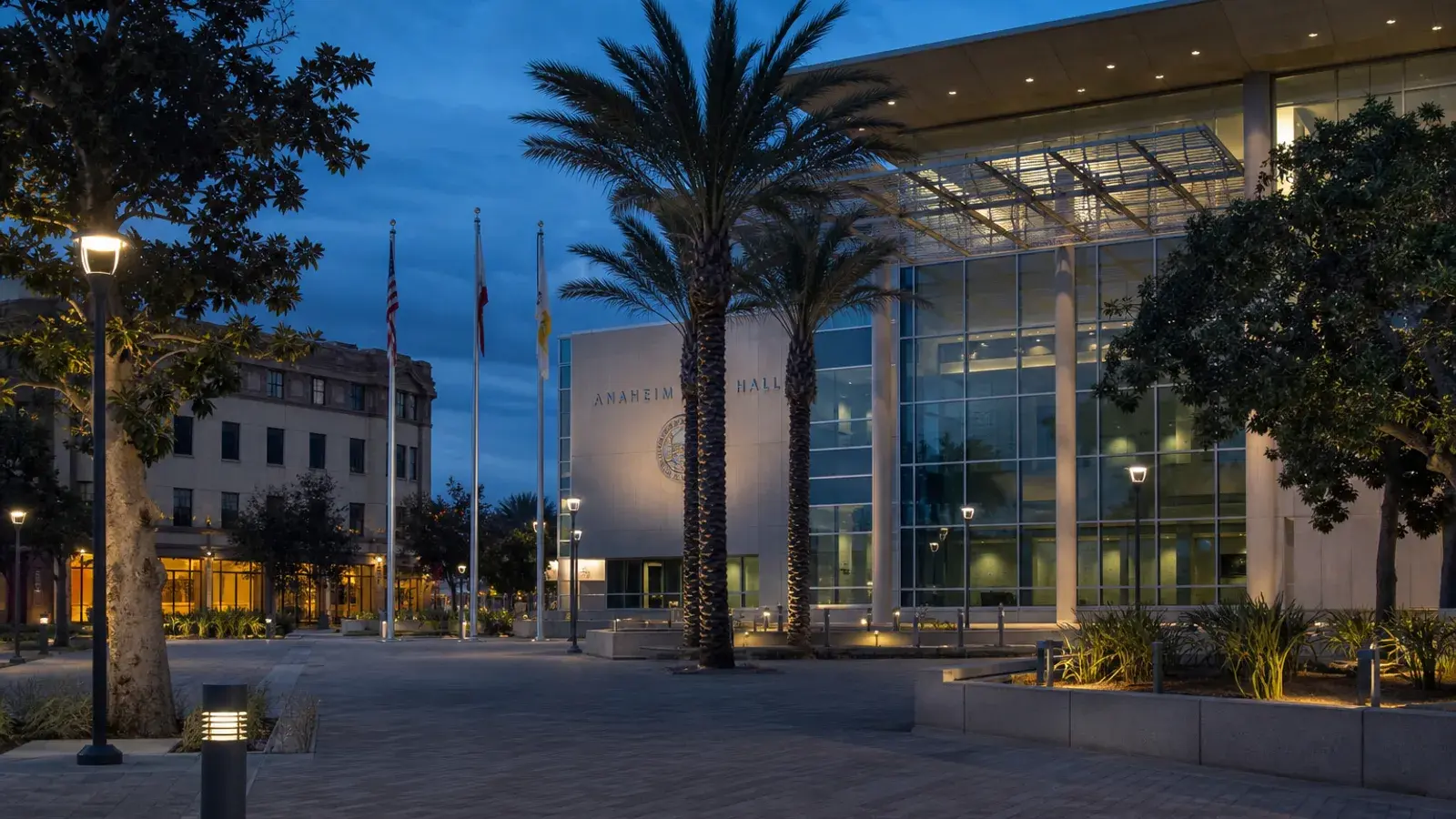 Anaheim civic exterior plaza at blue hour — gynecomastia lifestyle Anaheim civic exterior plaza at blue hour — gynecomastia lifestyle | SurgiSculpt®