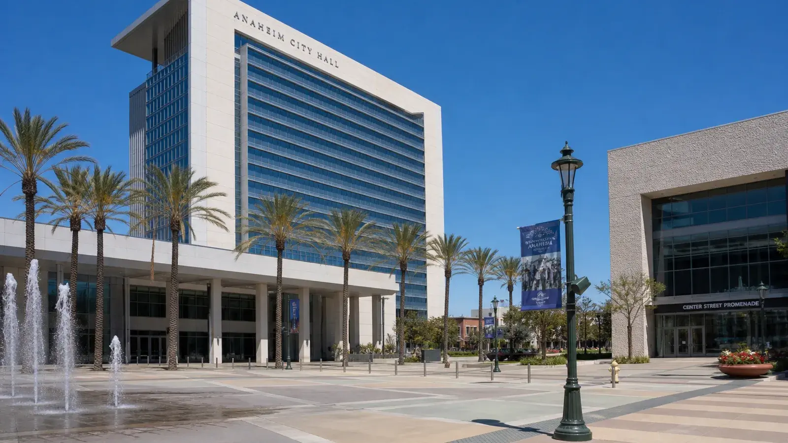 Anaheim civic district outdoor plaza and palm trees midday — HD Liposuction context Anaheim civic district outdoor plaza and palm trees midday — HD Liposuction context | SurgiSculpt®
