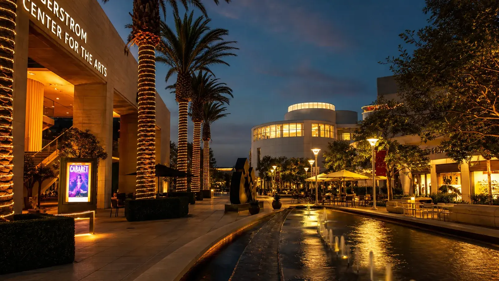Costa Mesa arts district outdoor plaza evening lights — breast augmentation lifestyle Costa Mesa arts district outdoor plaza evening lights — breast augmentation lifestyle | SurgiSculpt®