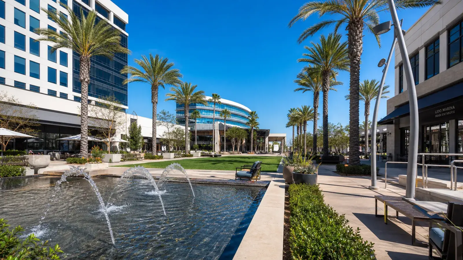 Palm-lined outdoor plaza near South Coast Costa Mesa — breast augmentation context Palm-lined outdoor plaza near South Coast Costa Mesa — breast augmentation context | SurgiSculpt®