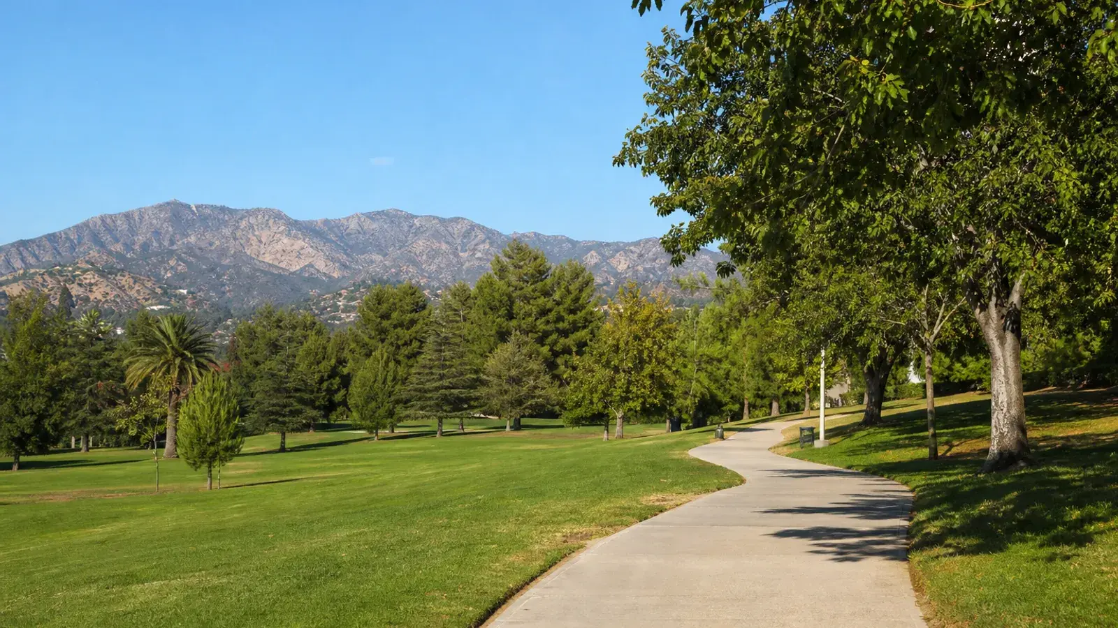 Encino park path with Santa Monica Mountains backdrop — tummy tuck lifestyle Encino park path with Santa Monica Mountains backdrop — tummy tuck lifestyle | SurgiSculpt®