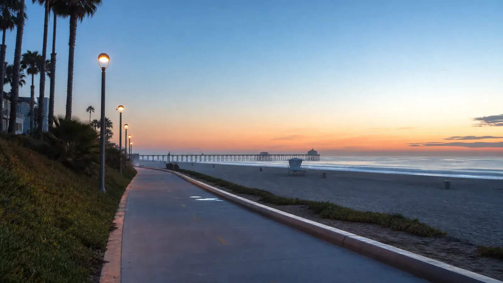 Huntington Beach beach path at dawn with pier silhouette — gynecomastia lifestyle Huntington Beach beach path at dawn with pier silhouette — gynecomastia lifestyle | SurgiSculpt®