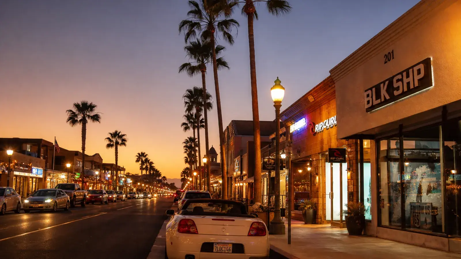 Huntington Beach Main Street outdoor evening glow — mommy makeover coastal mood Huntington Beach Main Street outdoor evening glow — mommy makeover coastal mood | SurgiSculpt®