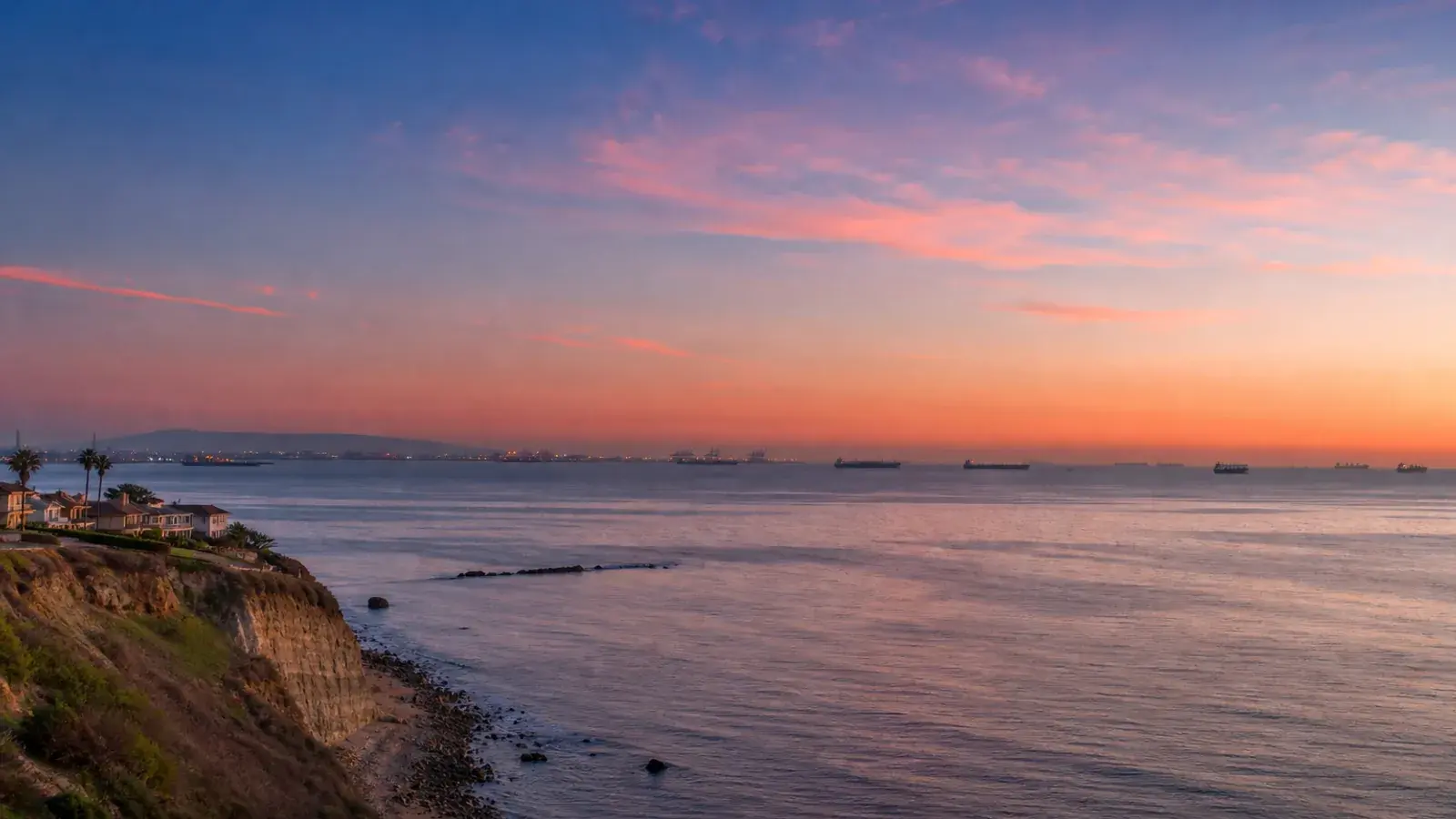 Pacific vista from Long Beach bluffs at soft dusk — breast augmentation context Pacific vista from Long Beach bluffs at soft dusk — breast augmentation context | SurgiSculpt®