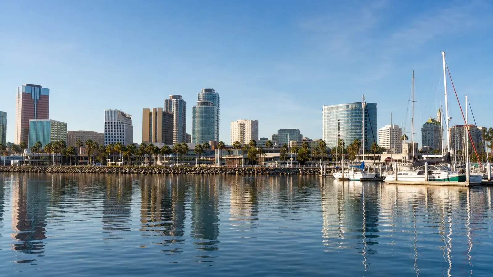 Long Beach waterfront skyline under soft morning light — tummy tuck context Long Beach waterfront skyline under soft morning light — tummy tuck context | SurgiSculpt®