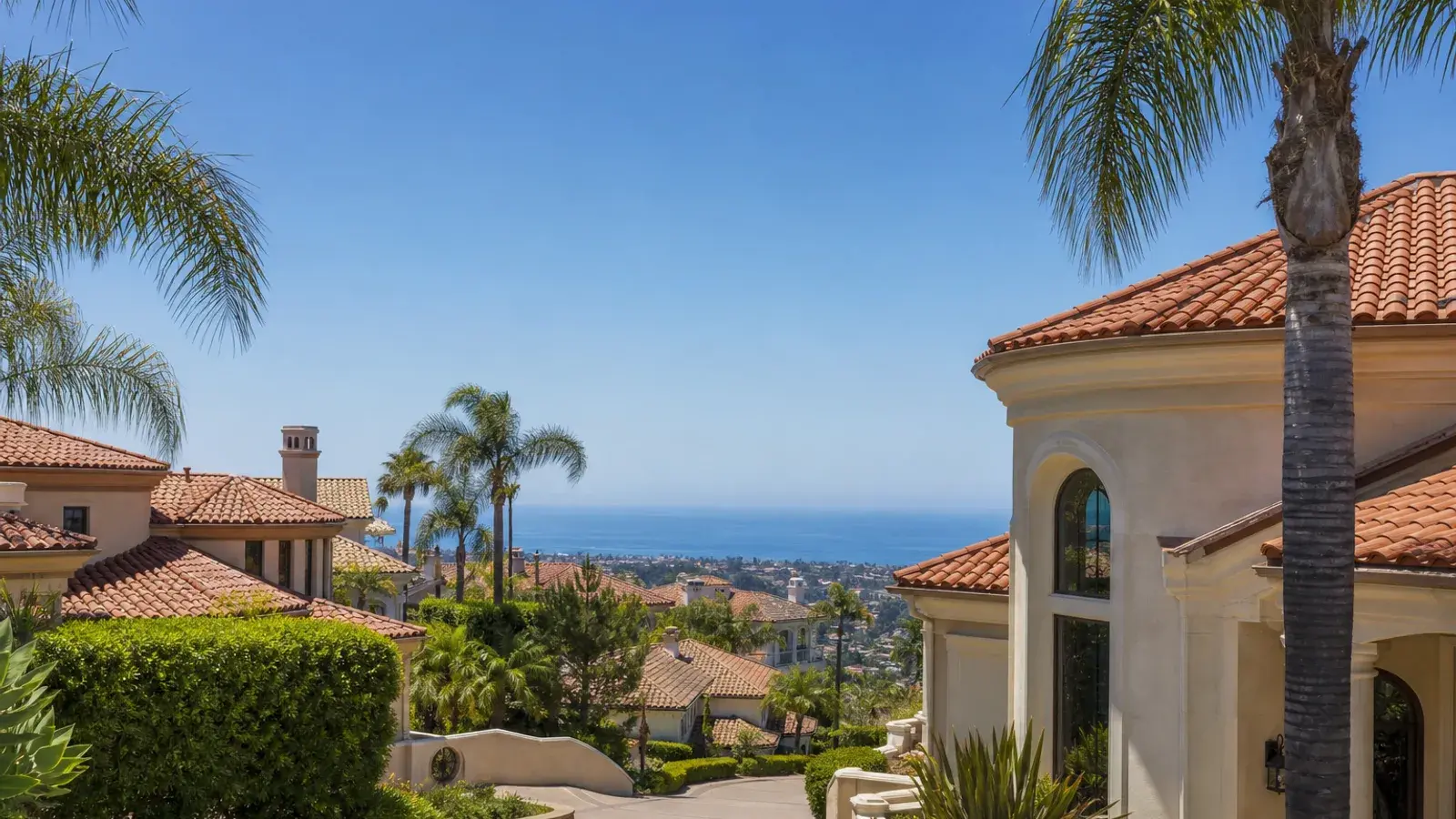 Laguna Niguel Mediterranean exteriors with ocean glimpse midday — breast augmentation lifestyle Laguna Niguel Mediterranean exteriors with ocean glimpse midday — breast augmentation lifestyle | SurgiSculpt®