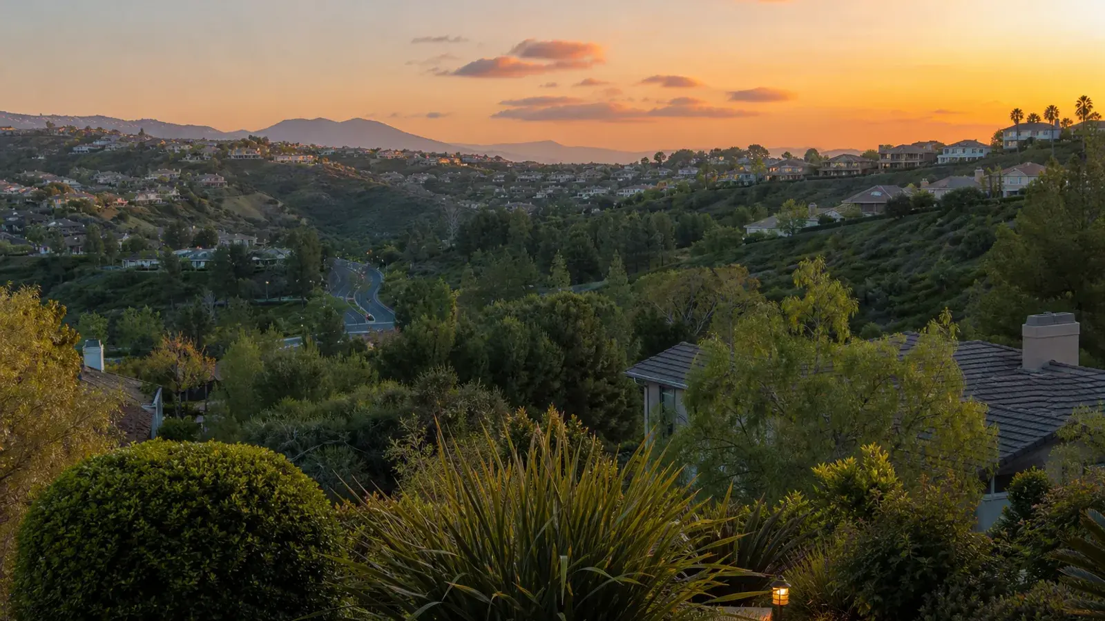 Mission Viejo evening glow over landscaped hills and greenery — mommy makeover mood Mission Viejo evening glow over landscaped hills and greenery — mommy makeover mood | SurgiSculpt®