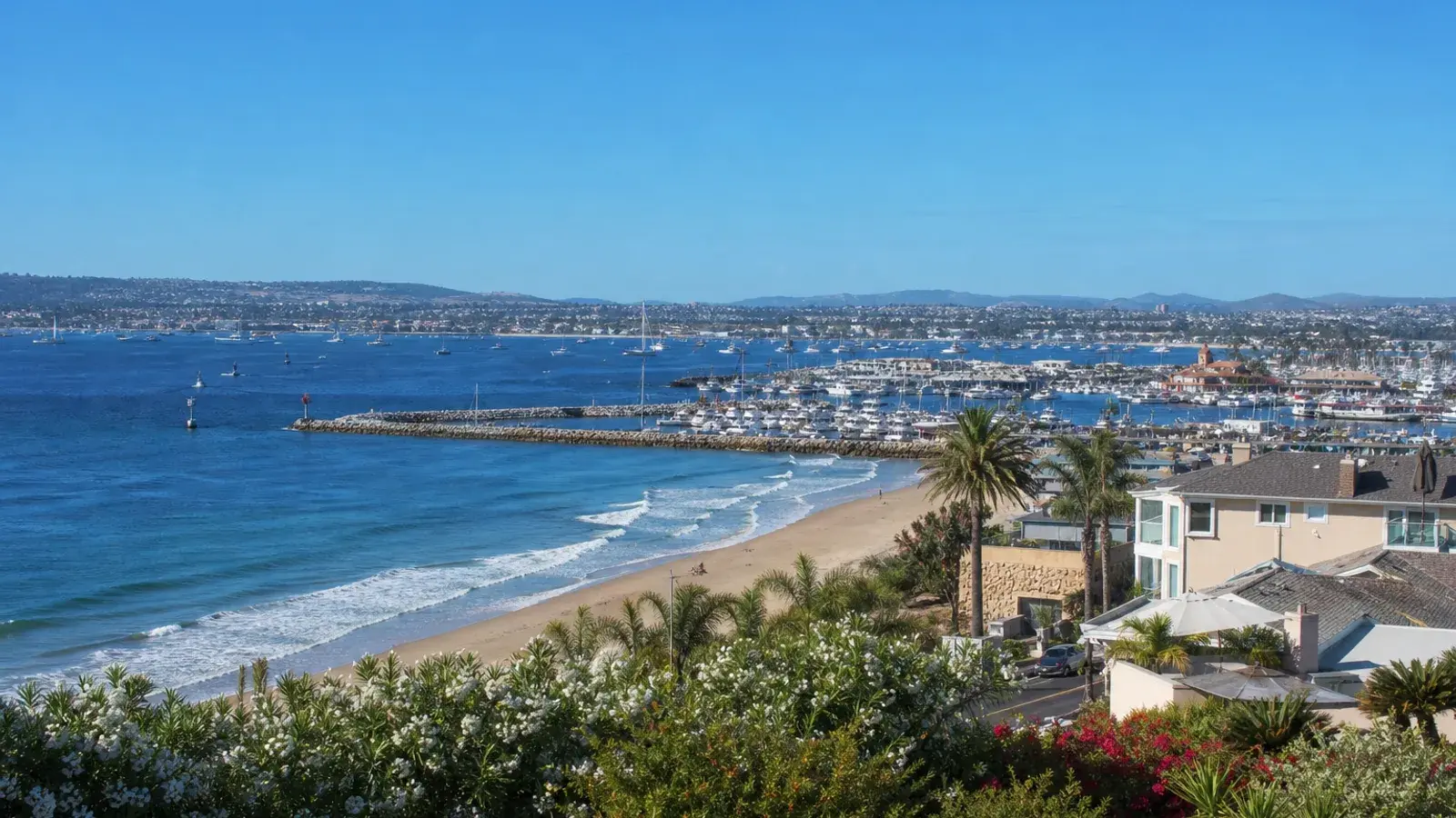 Newport Beach shoreline overlook toward the harbor — gynecomastia lifestyle Newport Beach shoreline overlook toward the harbor — gynecomastia lifestyle | SurgiSculpt®