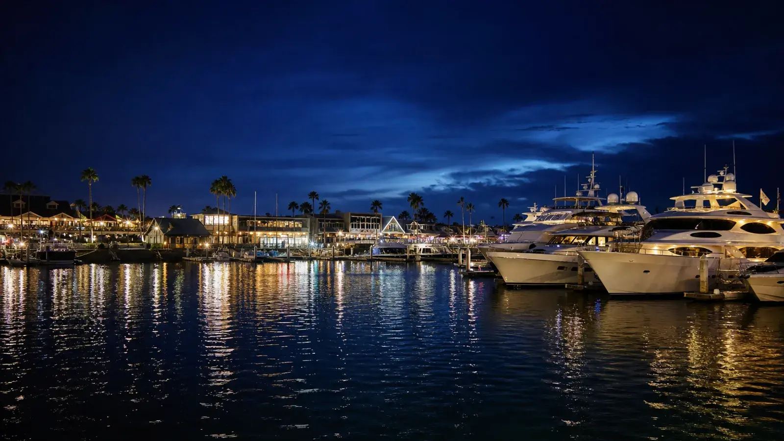 Newport Harbor blue hour with marina lights — mommy makeover coastal mood Newport Harbor blue hour with marina lights — mommy makeover coastal mood | SurgiSculpt®