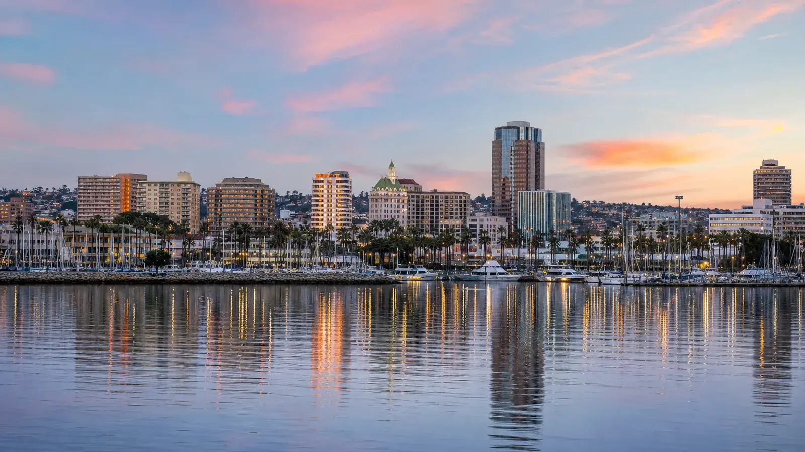 Pretty San Pedro port skyline across water at soft dawn — tummy tuck context Pretty San Pedro port skyline across water at soft dawn — tummy tuck context | SurgiSculpt®