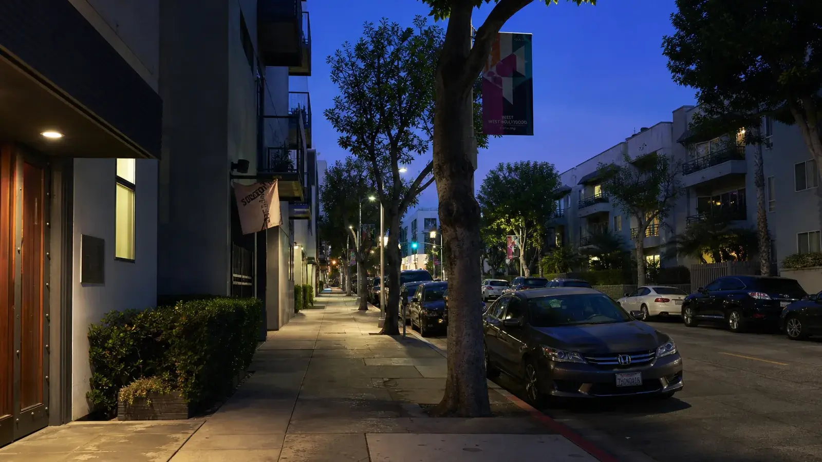 Quiet West Hollywood side street at blue hour — discreet gynecomastia logistics mood Quiet West Hollywood side street at blue hour — discreet gynecomastia logistics mood | SurgiSculpt®