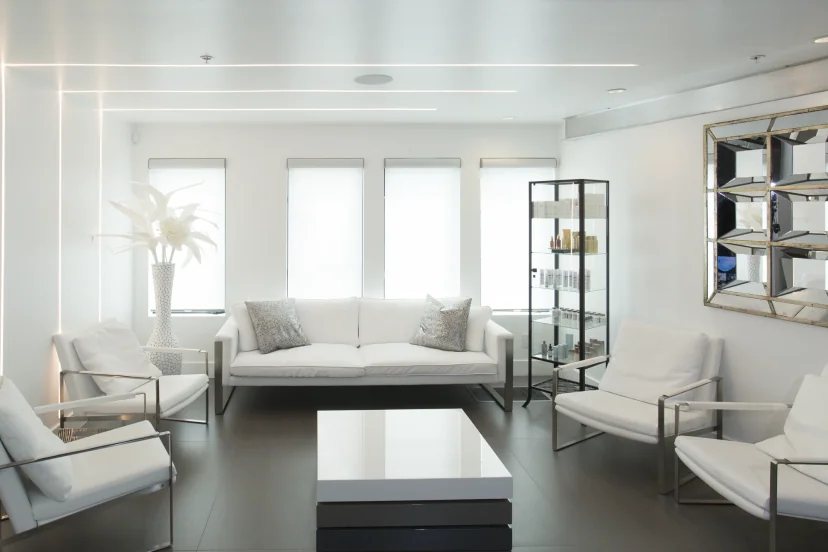 Financing Plans SurgiSculpt Laguna Beach waiting lounge with white seating and natural light | SurgiSculpt®